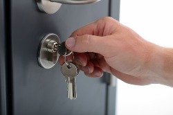 locking or unlocking a security key on a door